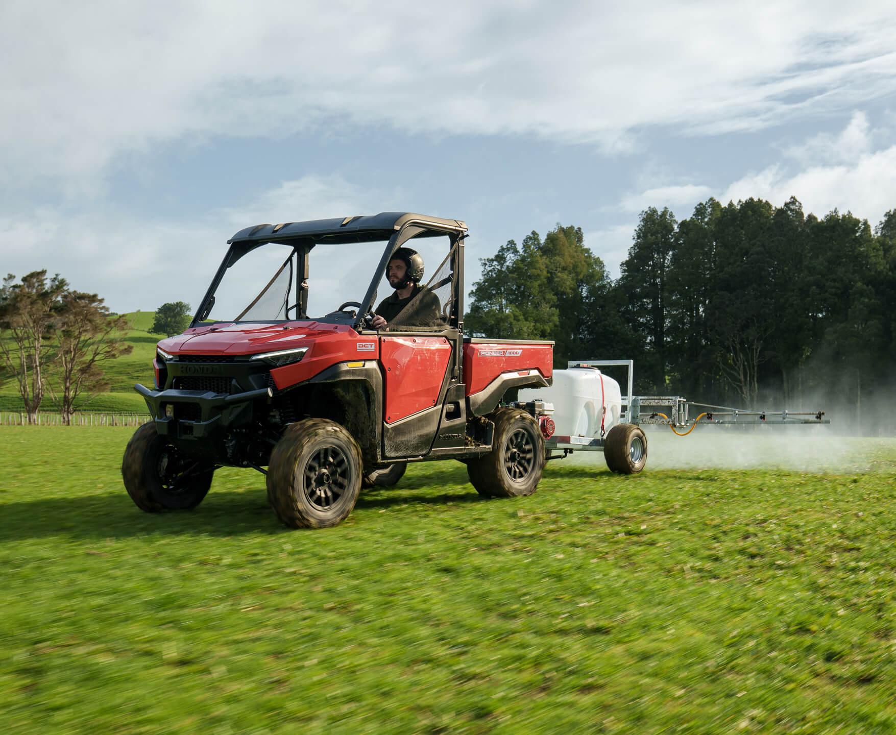 Pioneer 1000 spraying across a field